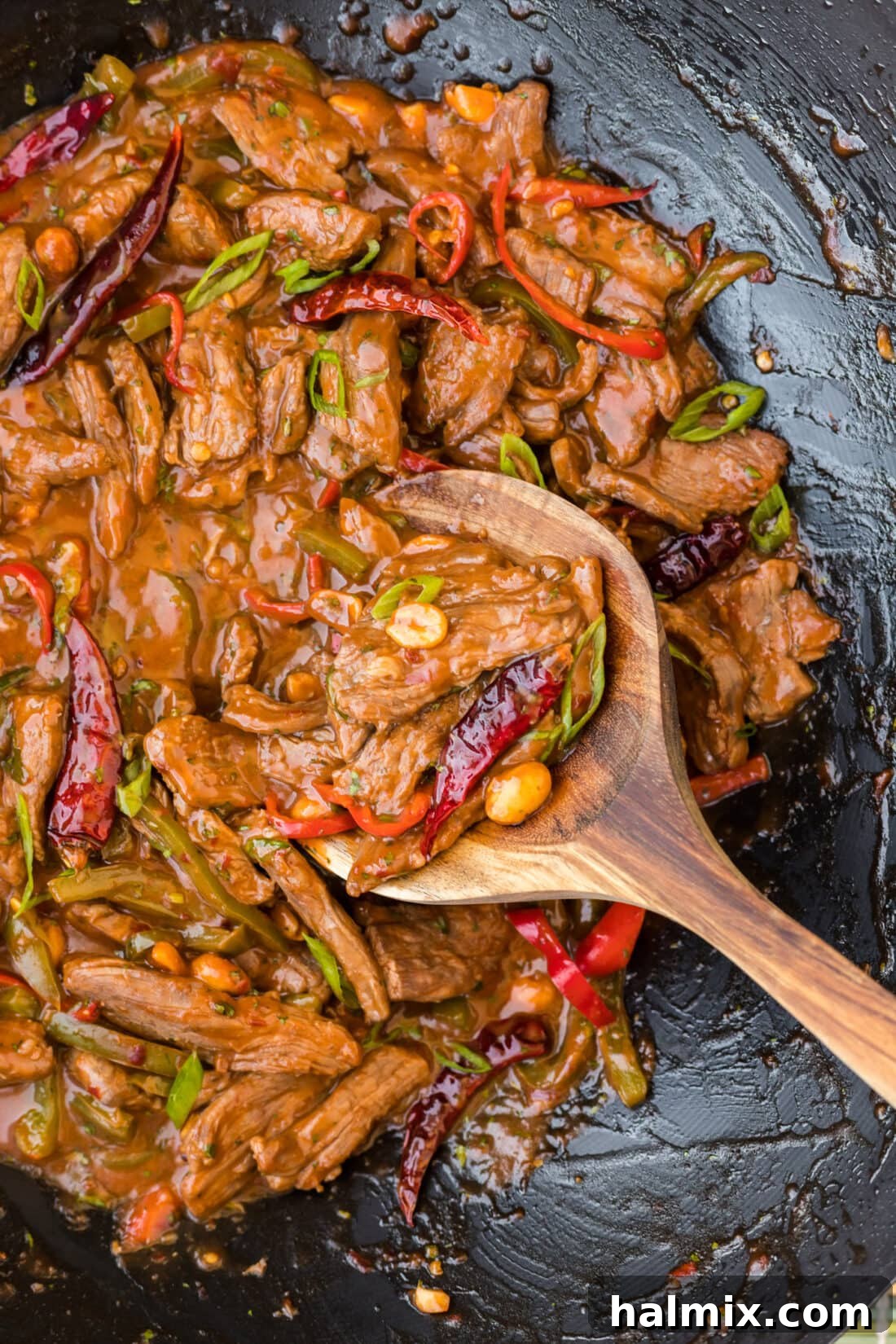 Kung Pao Beef in a wok, showcasing the vibrant ingredients and rich sauce