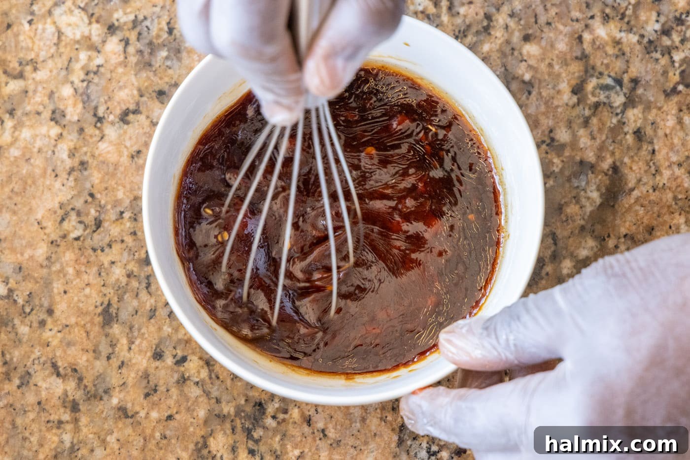 Ingredients for Kung Pao sauce being whisked together in a bowl