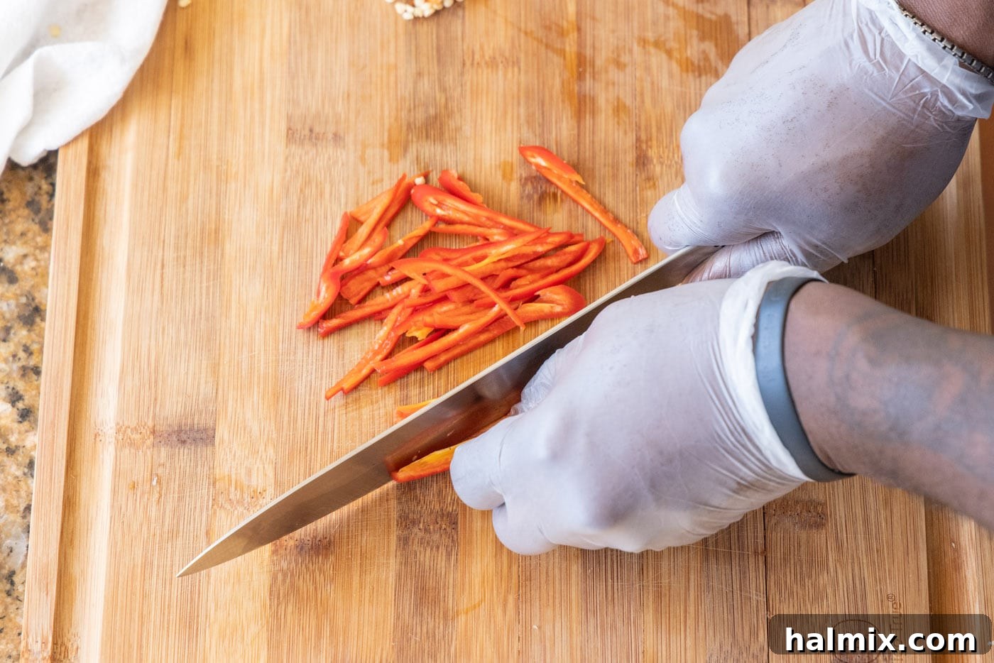 Julienned red jalapenos and green peppers prepared for stir-frying