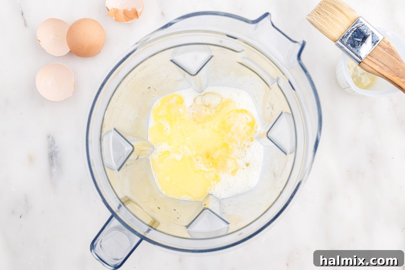 Golden Popovers 5 Blending melted butter, eggs, and milk in a blender for popover batter.