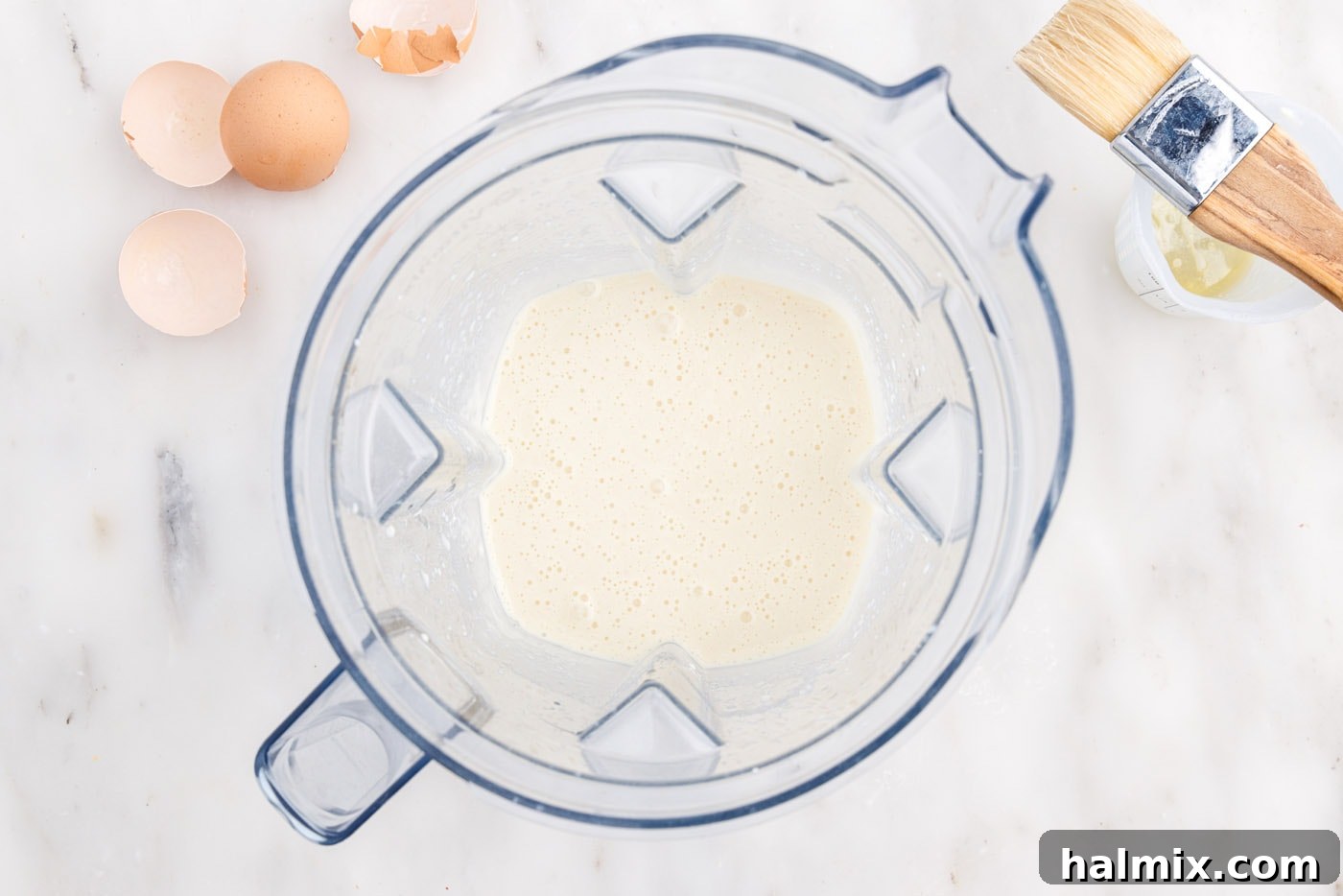 Golden Popovers 7 Smooth, blended popover batter resting in a blender pitcher.