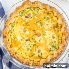 Delicious Ham and Cheese Quiche, a perfect slice.