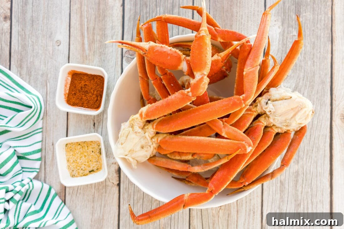 ingredients for Steamed Snow Crab Legs including crab legs, Old Bay, and garlic salt