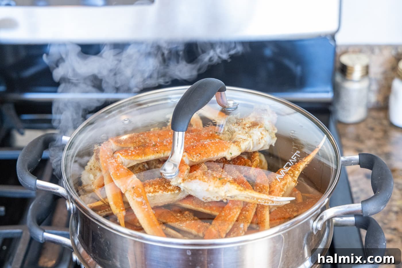 steam coming off of snow crab legs in steam pot