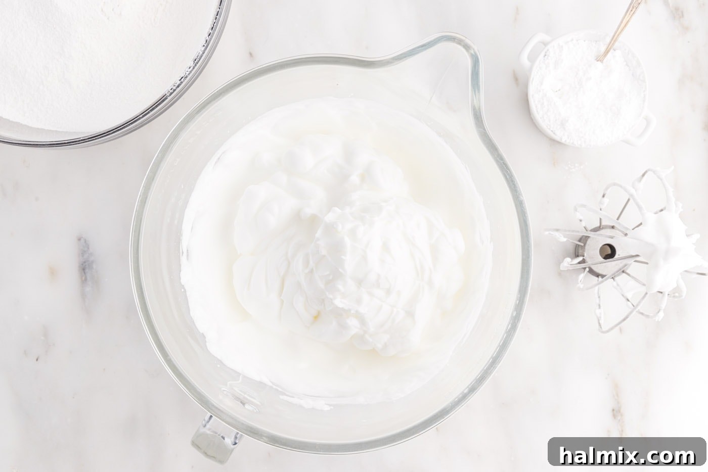 Perfectly whipped egg white meringue in a stand mixer
