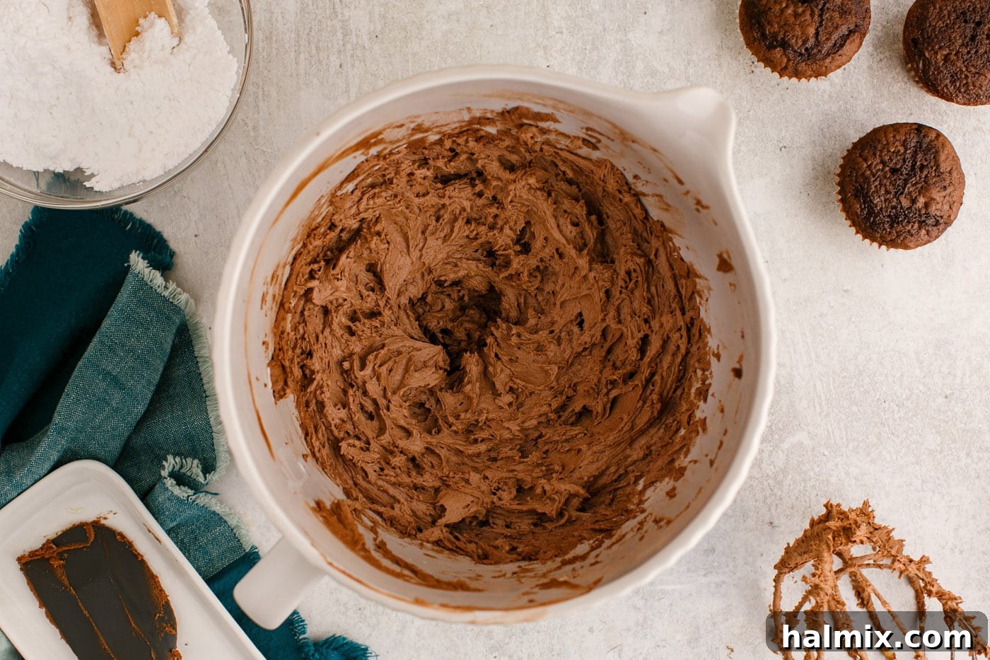 finished, fluffy chocolate buttercream frosting in a stand mixer bowl, perfectly textured