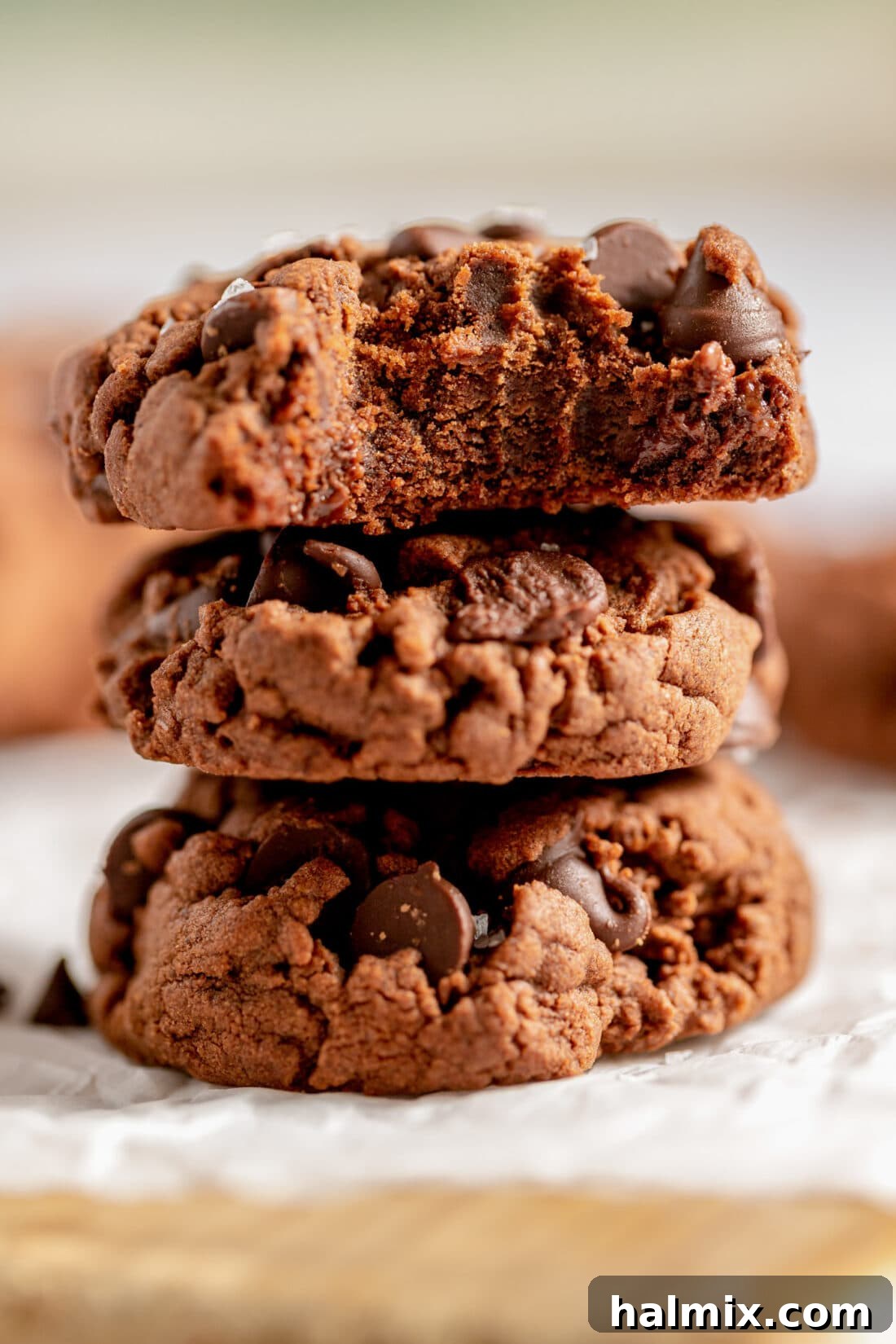 Luscious Chocolate Cake Mix Bites 3 A perfect stack of freshly baked chocolate cake mix cookies, showcasing their inviting texture and rich color.