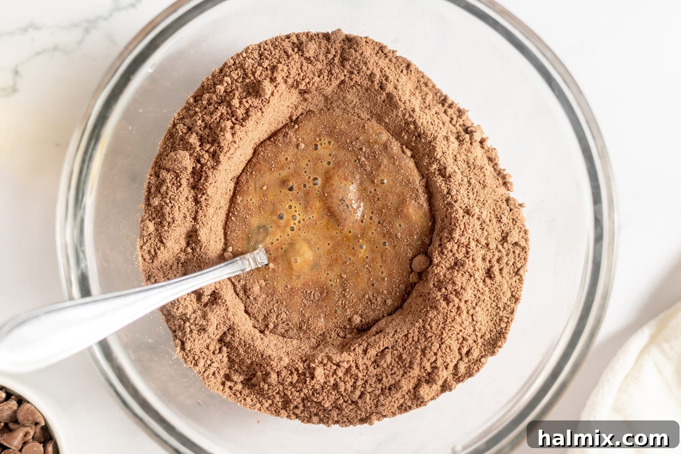 Luscious Chocolate Cake Mix Bites 6 Beaten eggs in the center of chocolate cake mix, ready for oil.