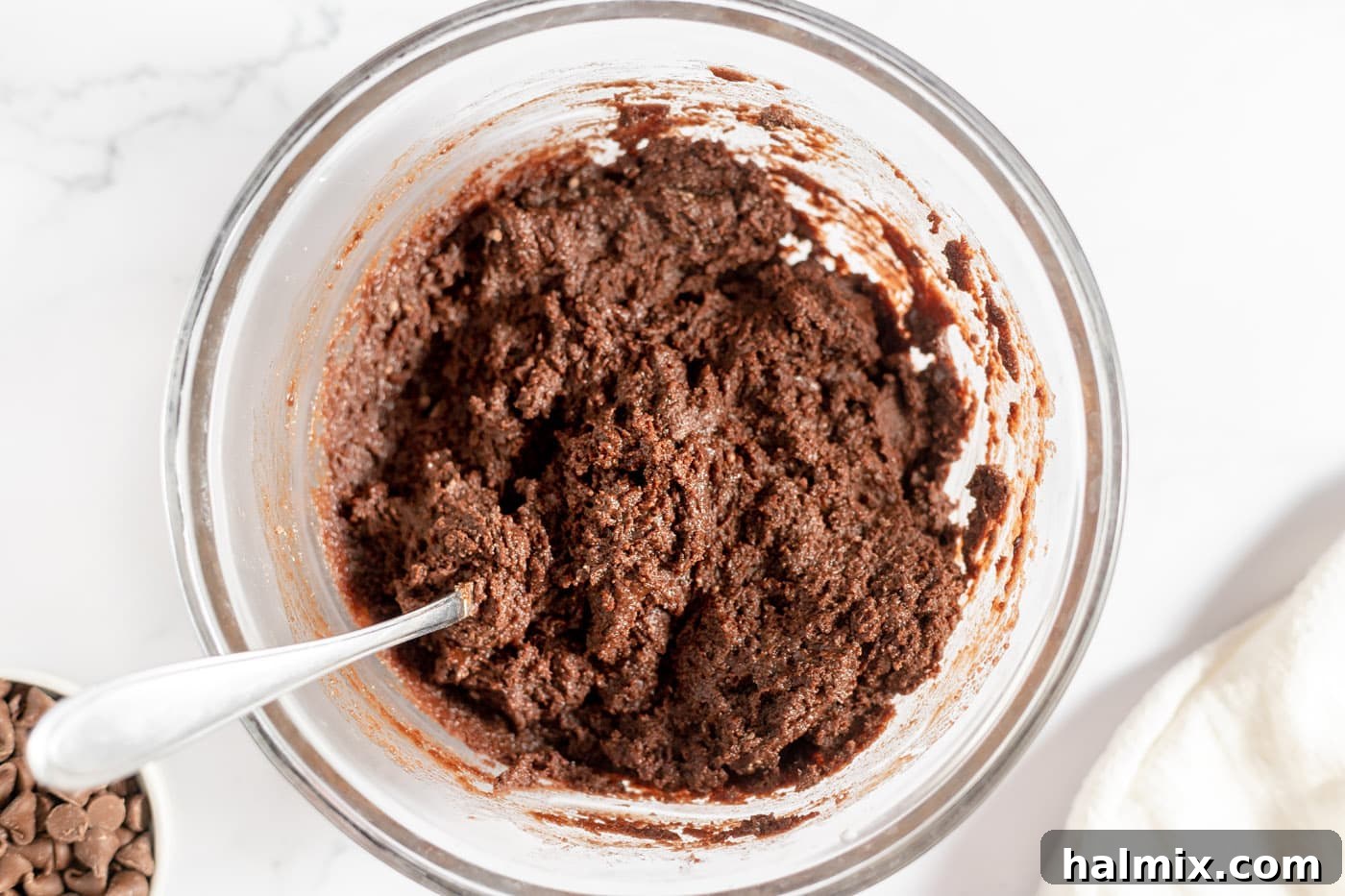 Luscious Chocolate Cake Mix Bites 8 Thick chocolate cake mix cookie dough forming in a bowl.