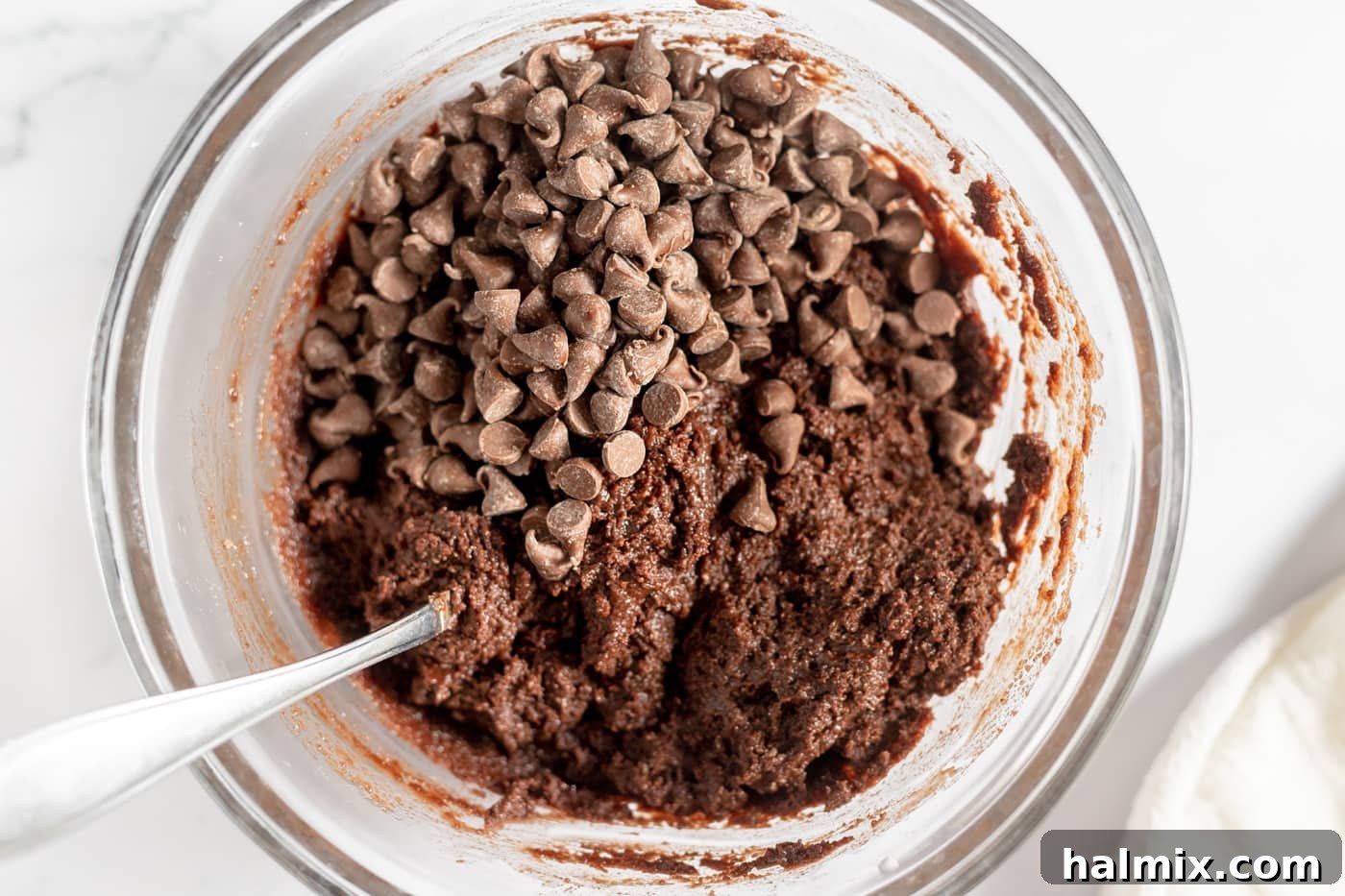Luscious Chocolate Cake Mix Bites 9 Chocolate chips being stirred into the chocolate cake mix cookie dough.