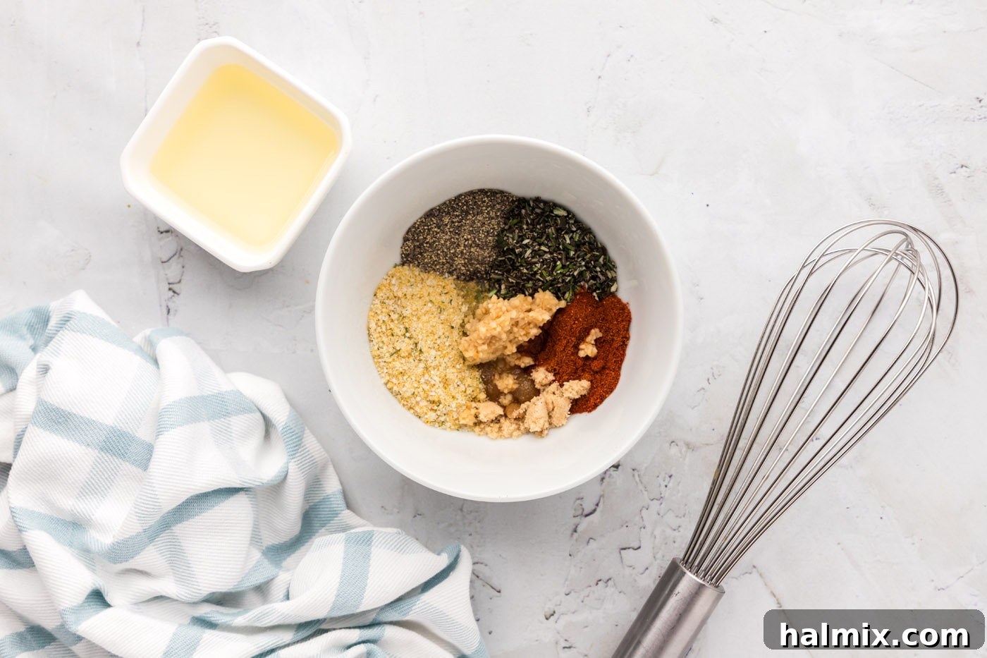 Bowl with a mixture of spices and olive oil for lamb rub