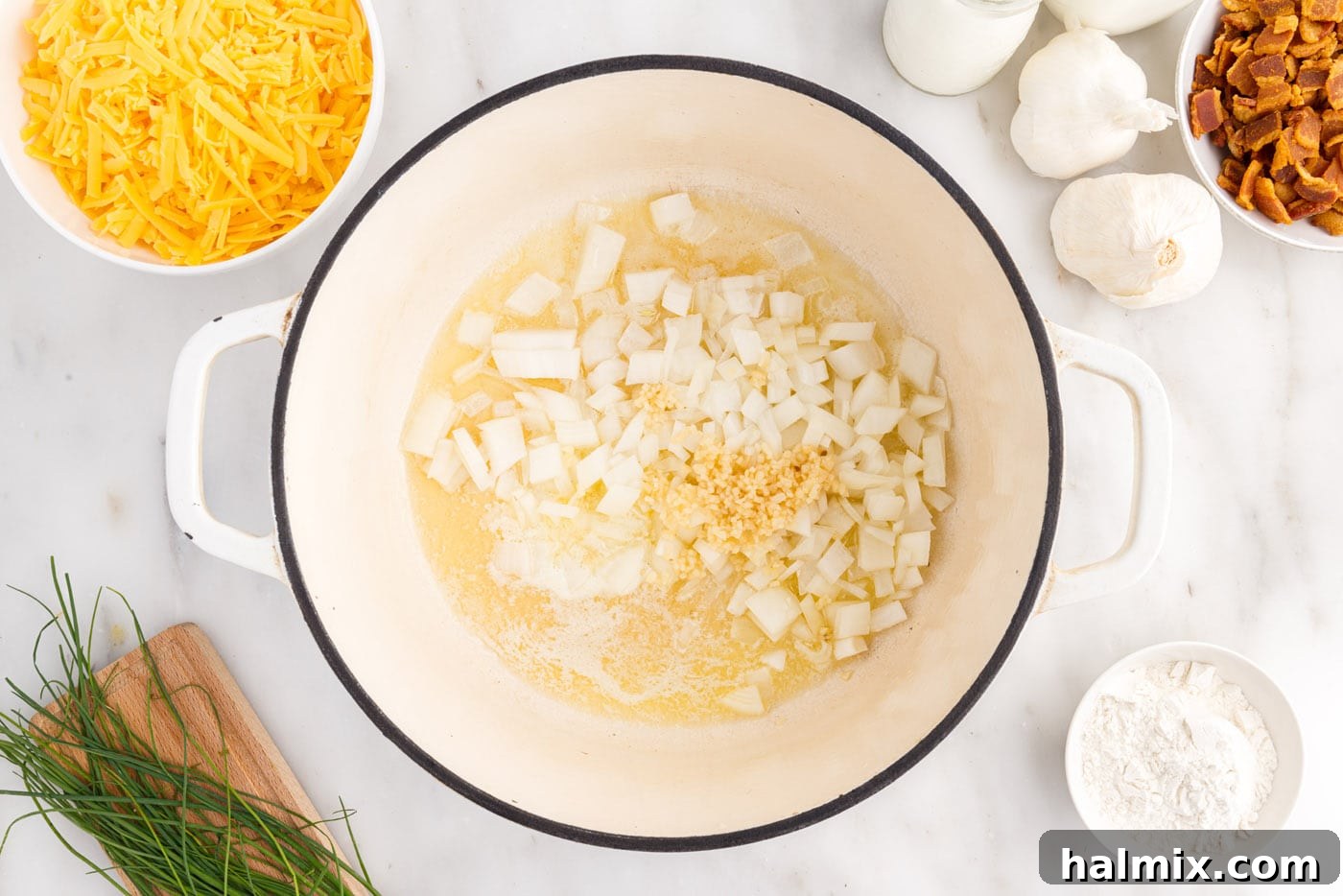 Hearty Loaded Baked Potato Soup 5 Sautéing finely chopped onions and minced garlic in melted butter in a stockpot.