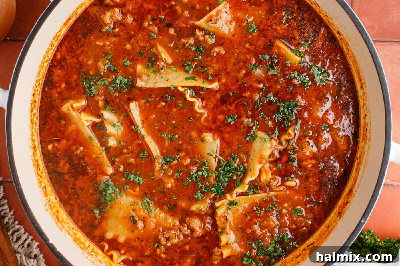 Freshly chopped parsley sprinkled over a pot of finished lasagna soup