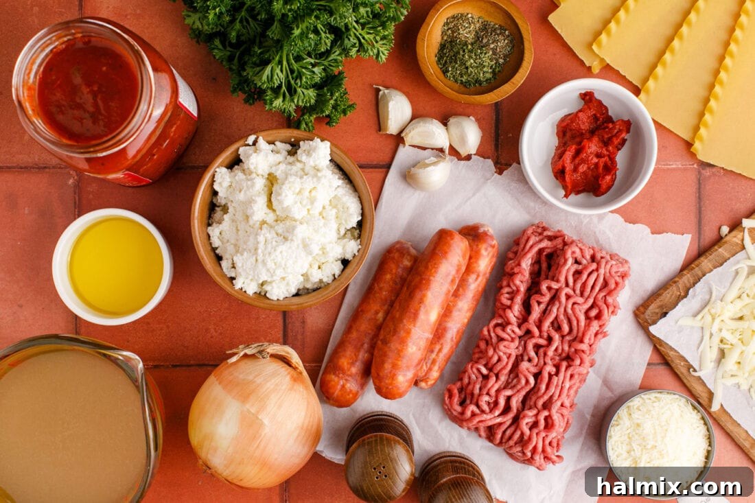 Assortment of fresh ingredients for Lasagna Soup including ground meat, cheeses, herbs, and noodles
