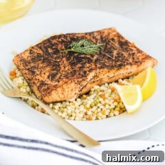 Sous Vide Salmon on a plate with a fork