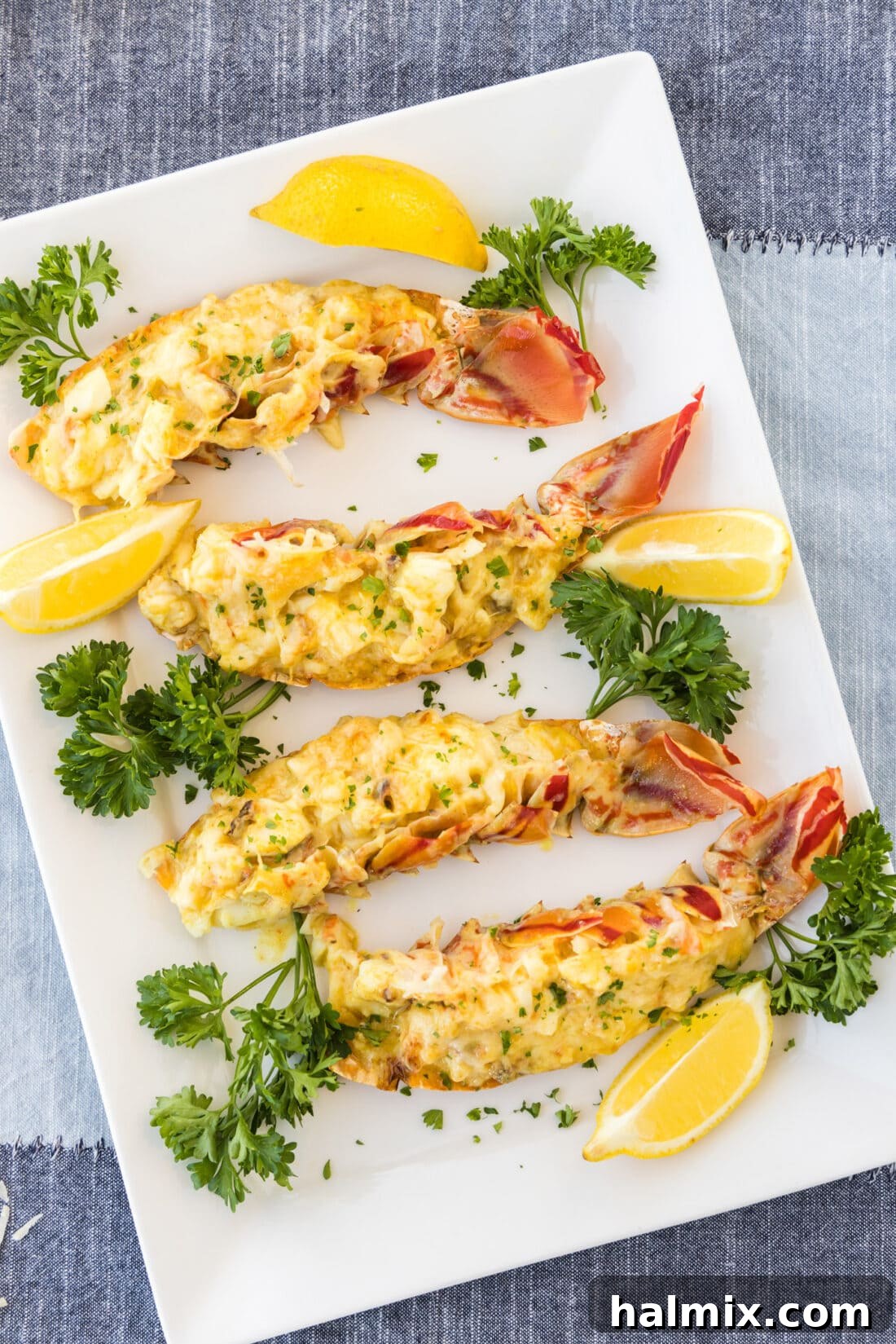 Golden Lobster Indulgence 2 Lobster Thermidor on a platter, garnished with fresh herbs
