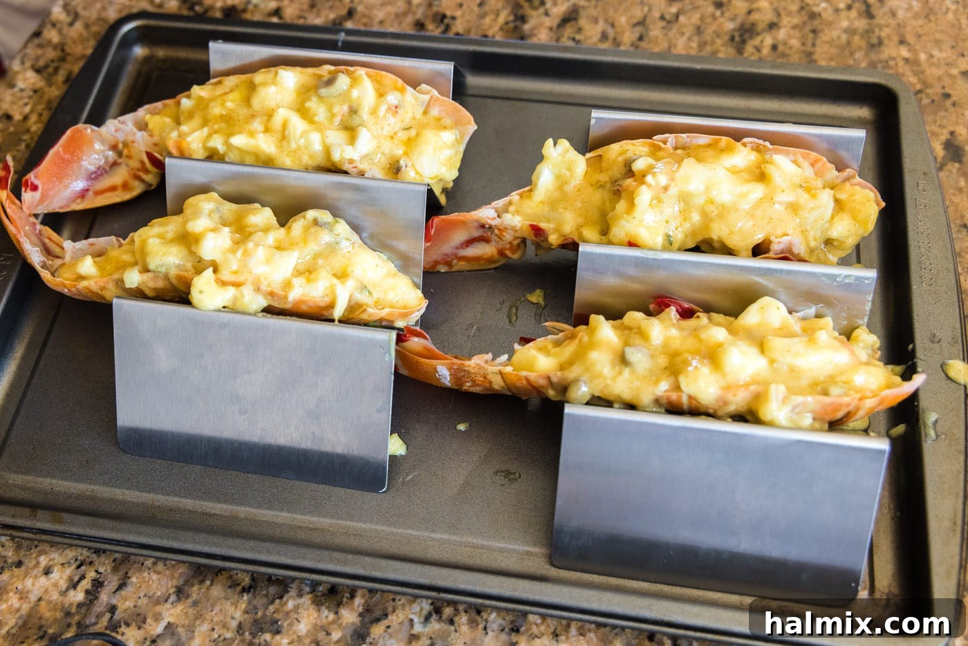 Golden Lobster Indulgence 17 lobster thermidor held in taco holders