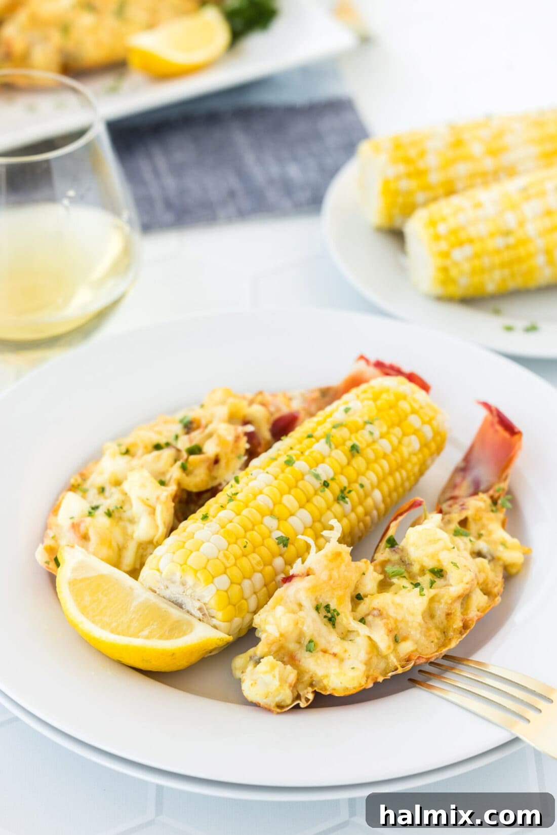 Golden Lobster Indulgence 20 Two plates of Lobster Thermidor on a table, ready to be served