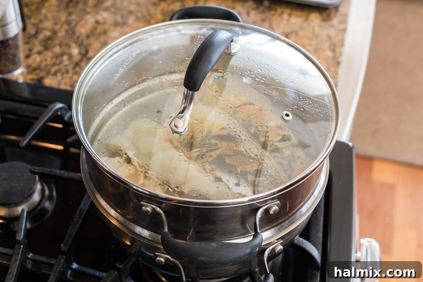 Golden Lobster Indulgence 6 lobster tails steaming in a pot
