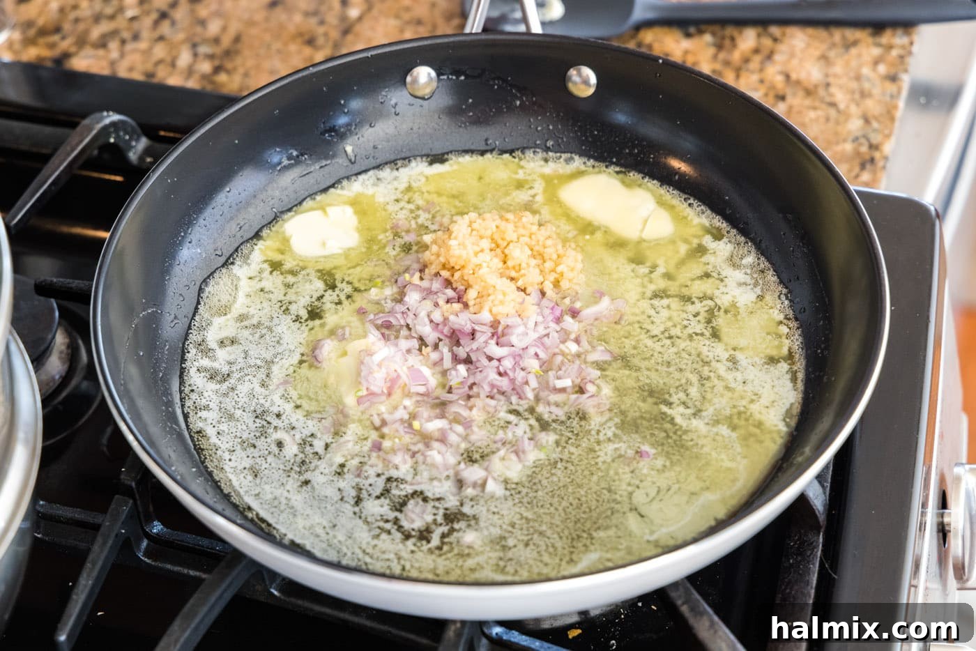 Golden Lobster Indulgence 9 butter, shallots, garlic, lemon juice, and white wine in a skillet
