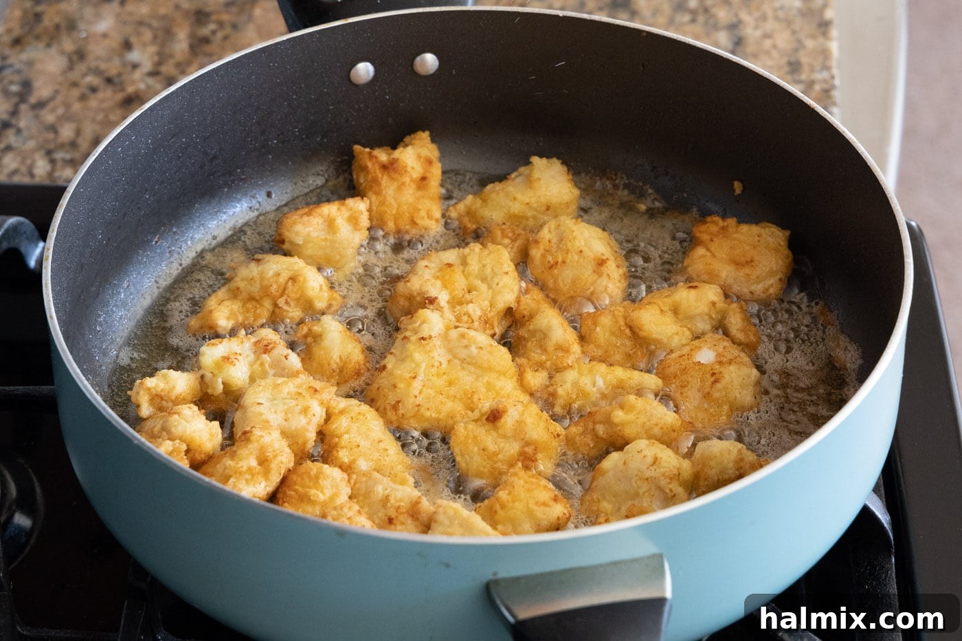 fried chopped chicken in a skillet