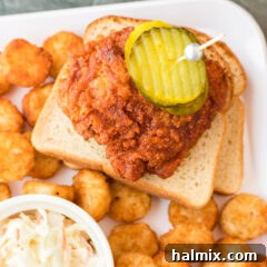 Piece of Nashville Hot Chicken resting on bread