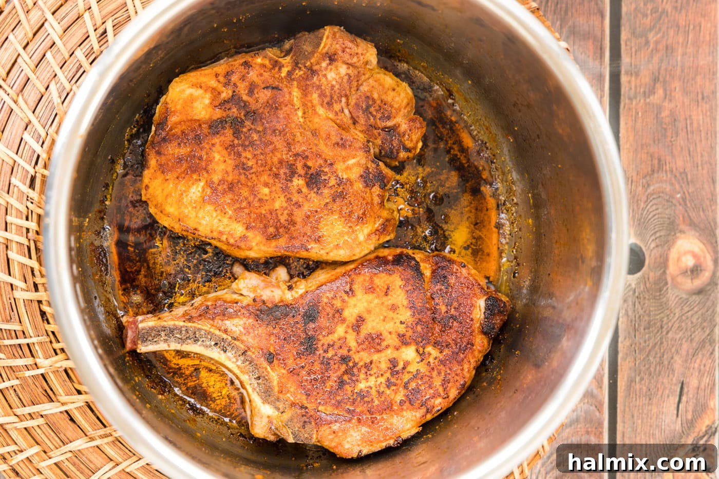 searing pork chops in the Instant Pot on sauté mode, achieving a golden crust