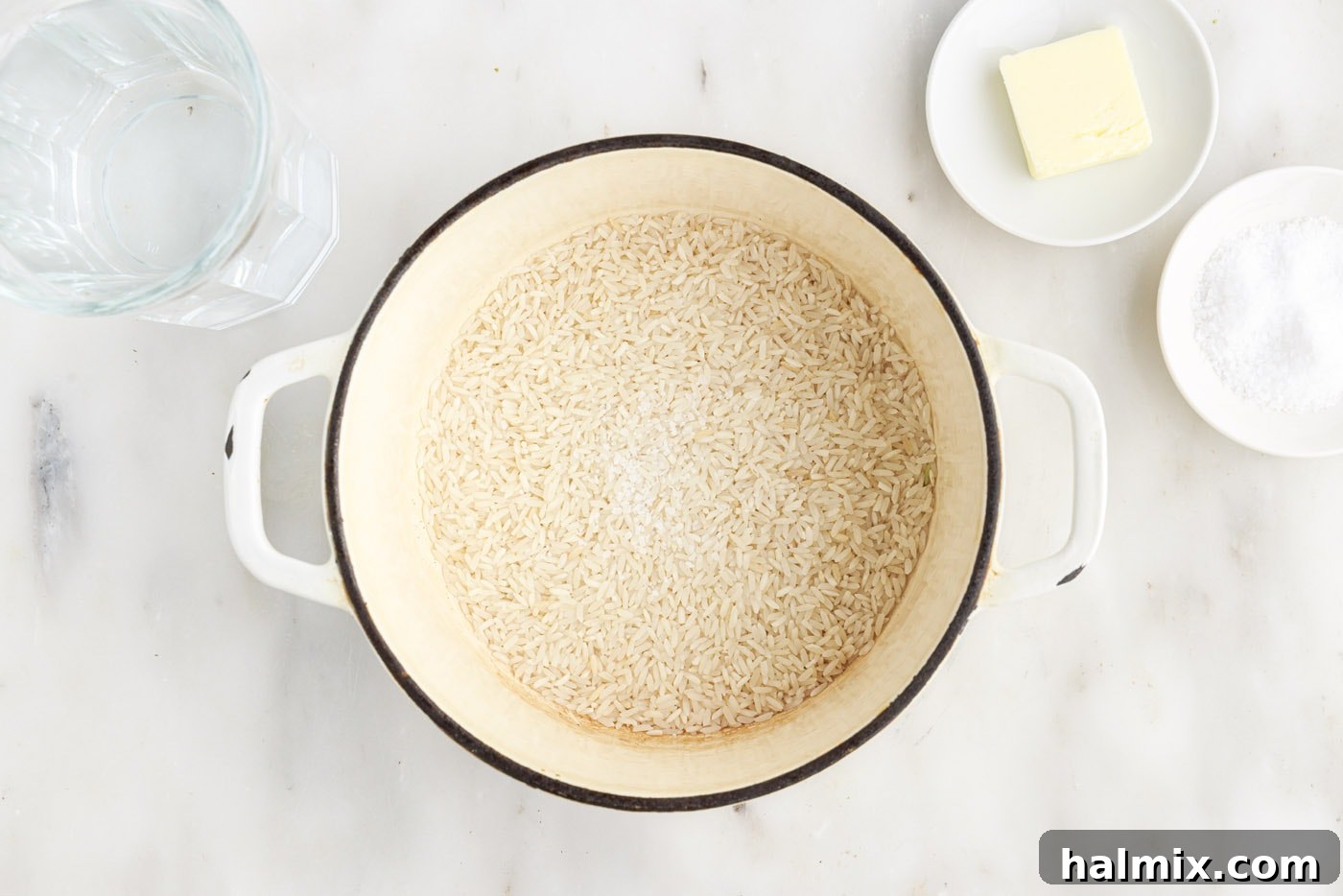 White rice placed in a medium saucepan before adding liquid
