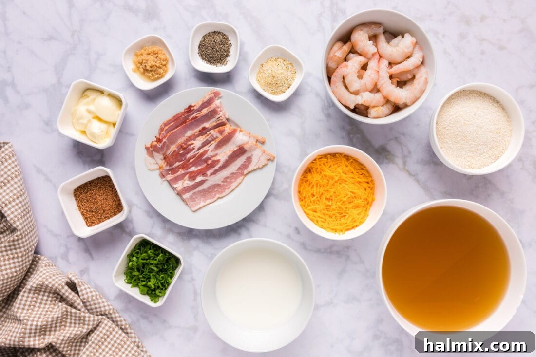 A selection of fresh ingredients laid out for preparing Shrimp and Grits, including raw shrimp, bacon, grits, and spices, ready for cooking.