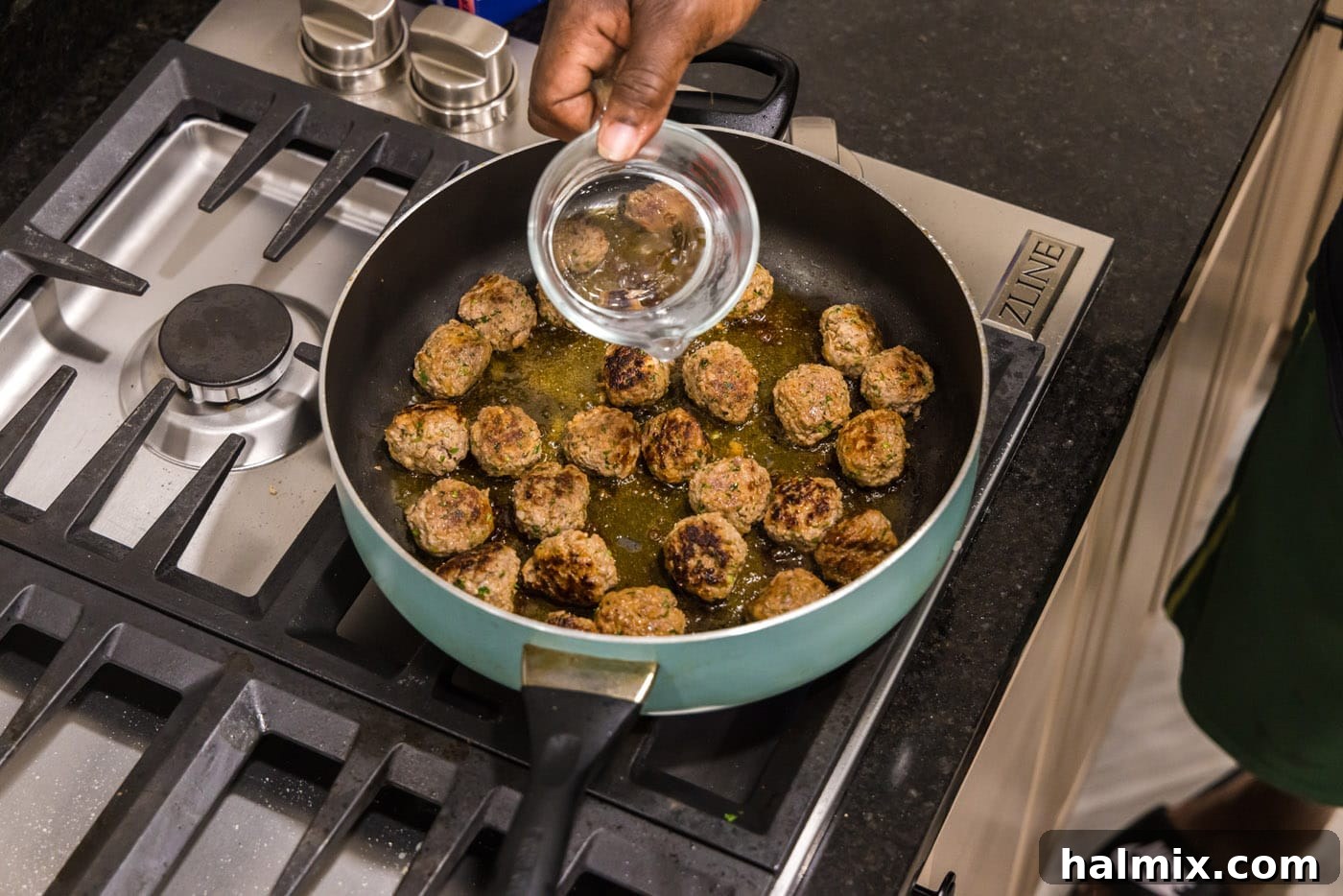Adding a small, measured amount of water to the skillet with browned lamb meatballs before covering to steam.
