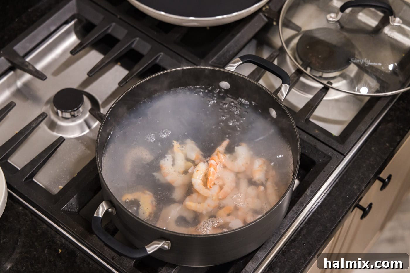 Zesty Shrimp Ceviche 6 poaching shrimp in a pot