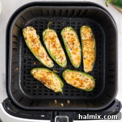 Air Fryer basket of Jalapeno Poppers