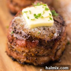 Close up of a delicious Bacon Wrapped Filet Mignon, perfectly cooked and ready to be served.