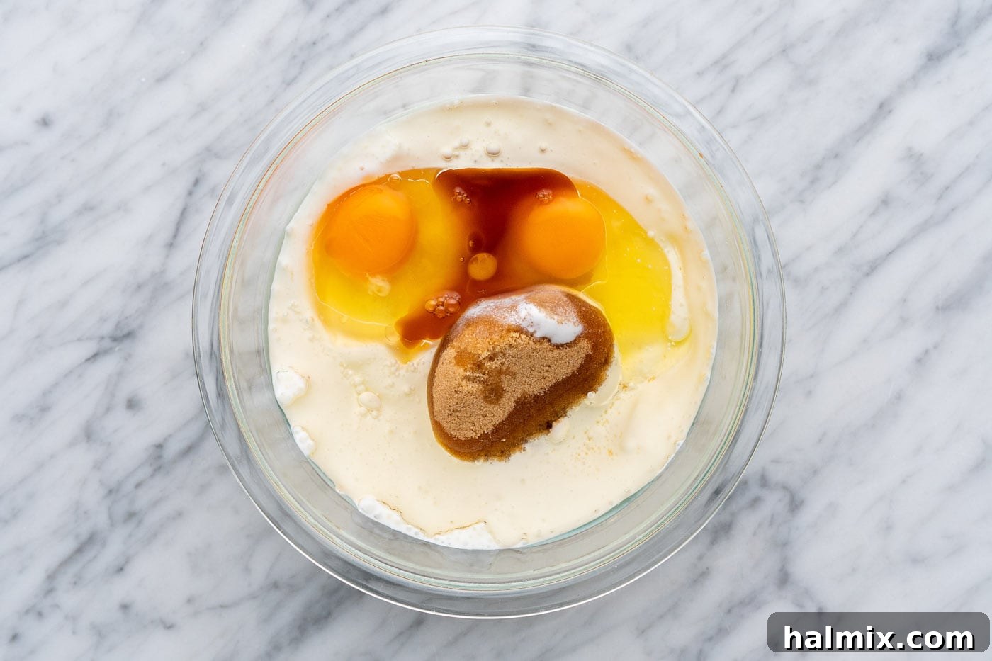 Granulated sugar, brown sugar, buttermilk, oil, eggs, and vanilla extract in a bowl