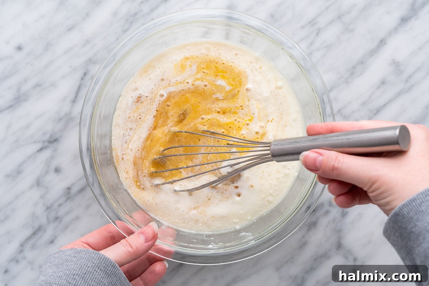 Whisking muffin ingredients together in a bowl until smooth