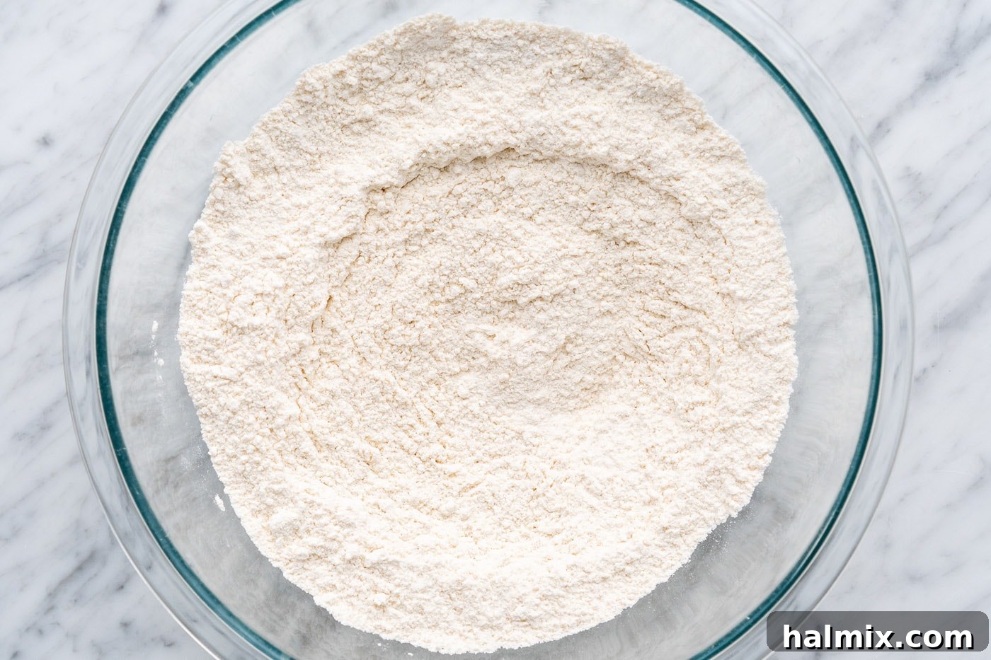 The fully combined dry ingredients for muffin batter in a large bowl