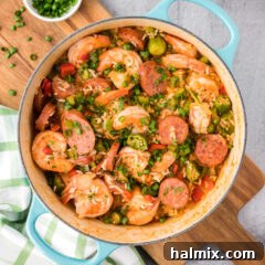 A pot of delicious Jambalaya on a wooden board, ready to be dished out.