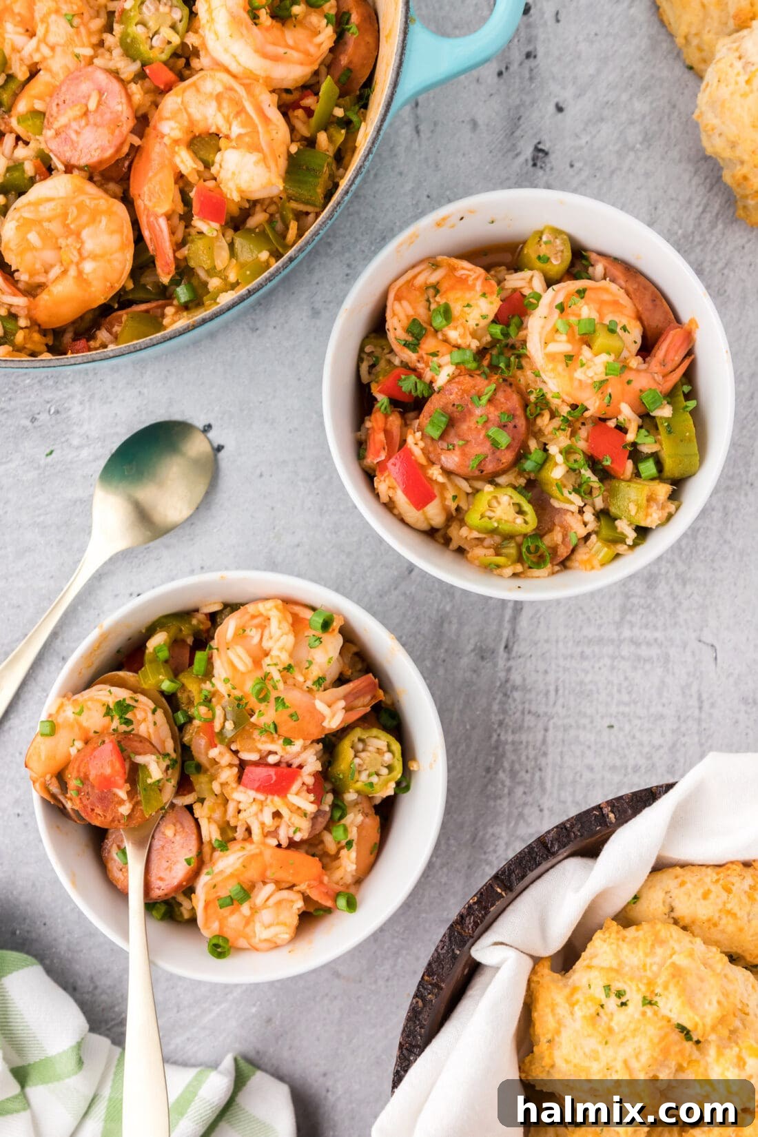 Bayou Blend 3 Two generous bowls of freshly made Jambalaya, garnished with fresh parsley, highlighting the vibrant colors and hearty ingredients of the dish.