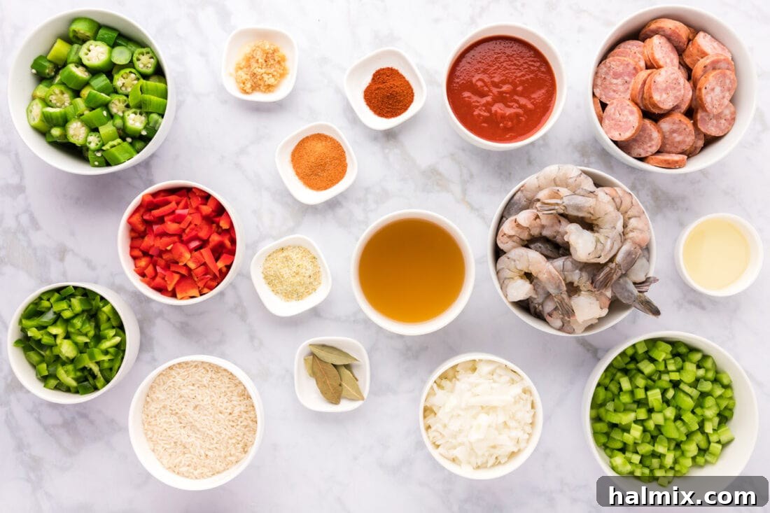 Bayou Blend 4 A visually appealing flat lay of all the fresh ingredients needed to make Jambalaya, neatly arranged on a rustic wooden surface.