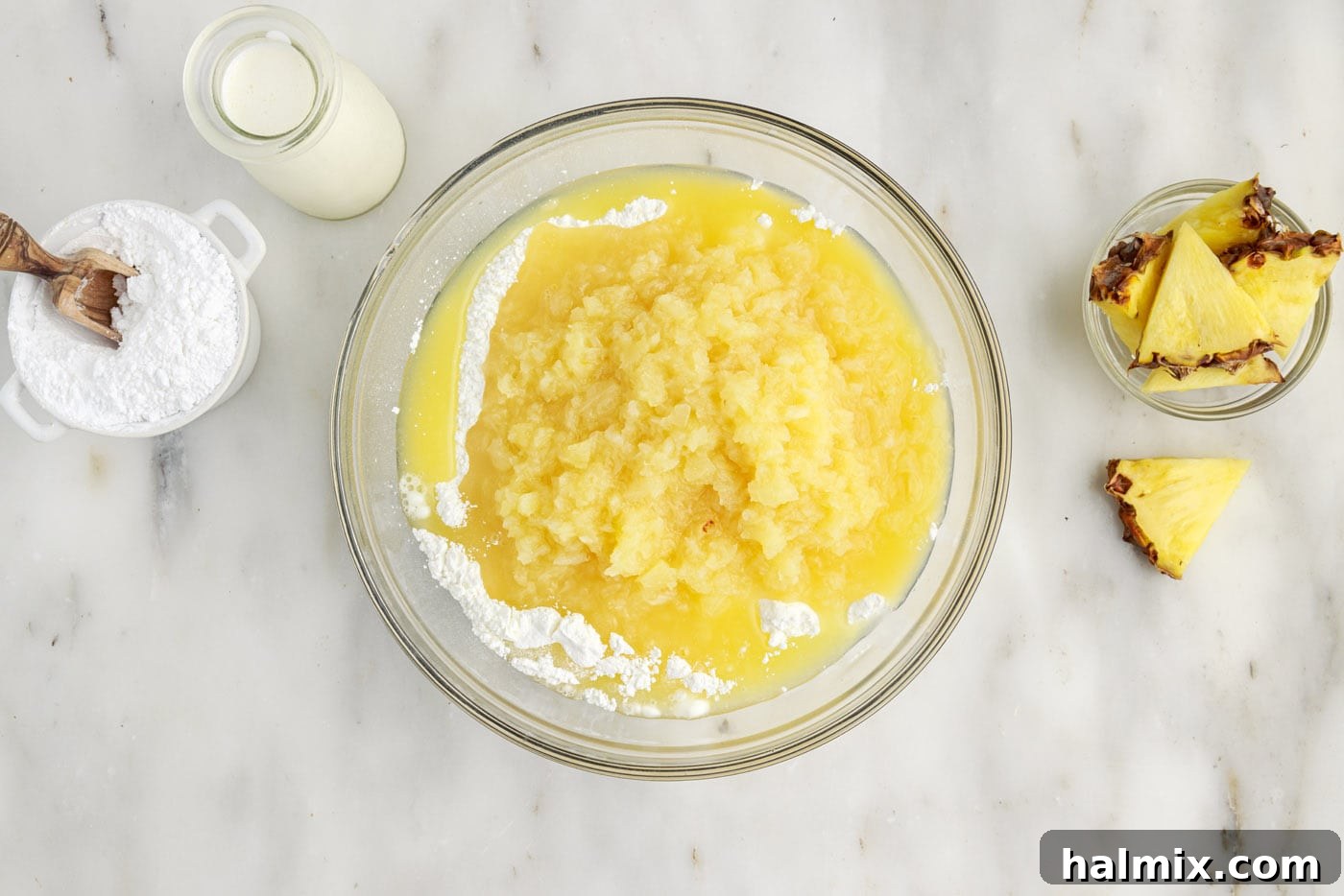crushed pineapple and angel food cake mix in a bowl
