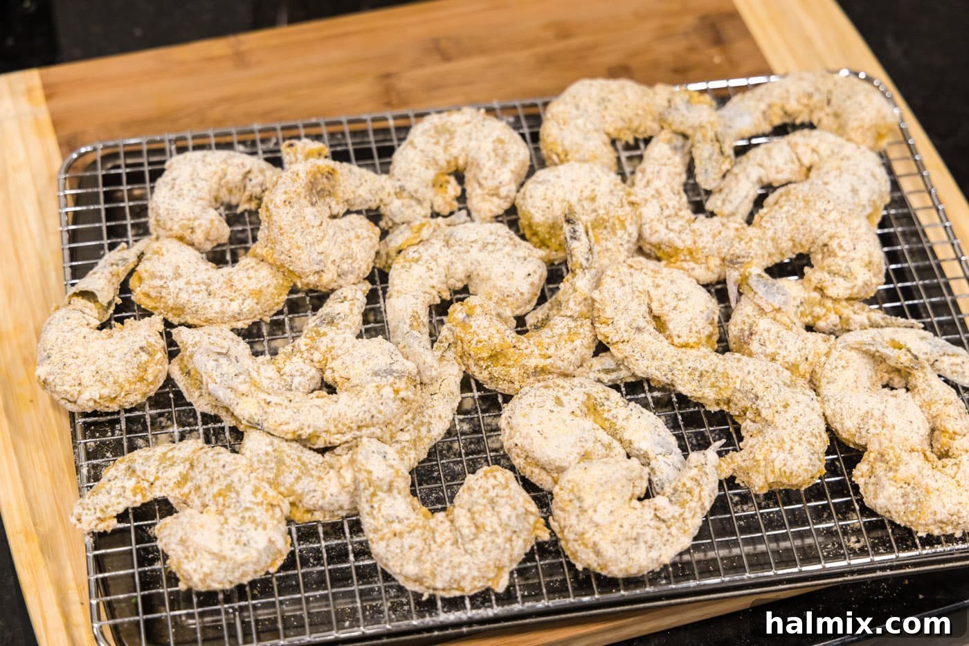 breaded shrimp on a wire rack
