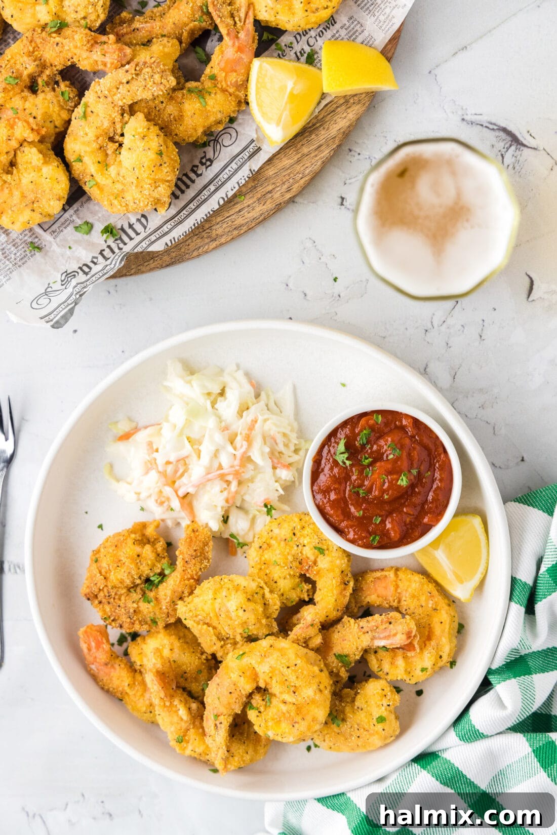Golden Crispy Shrimp 15 Plate of Fried Shrimp with a bowl of cocktail sauce and coleslaw