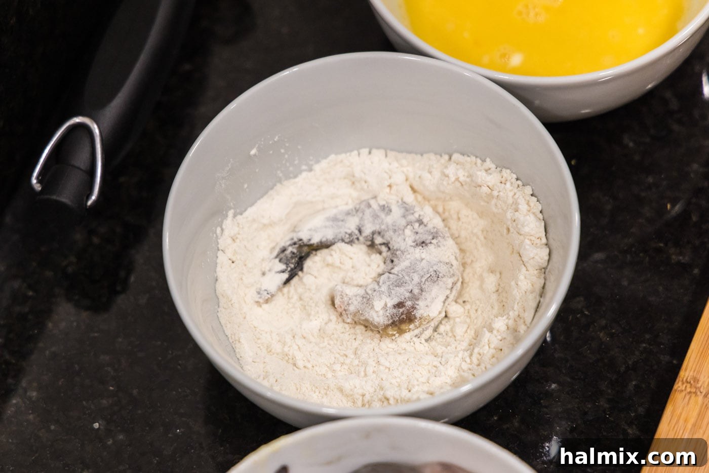 Golden Crispy Shrimp 8 shrimp in a bowl of flour