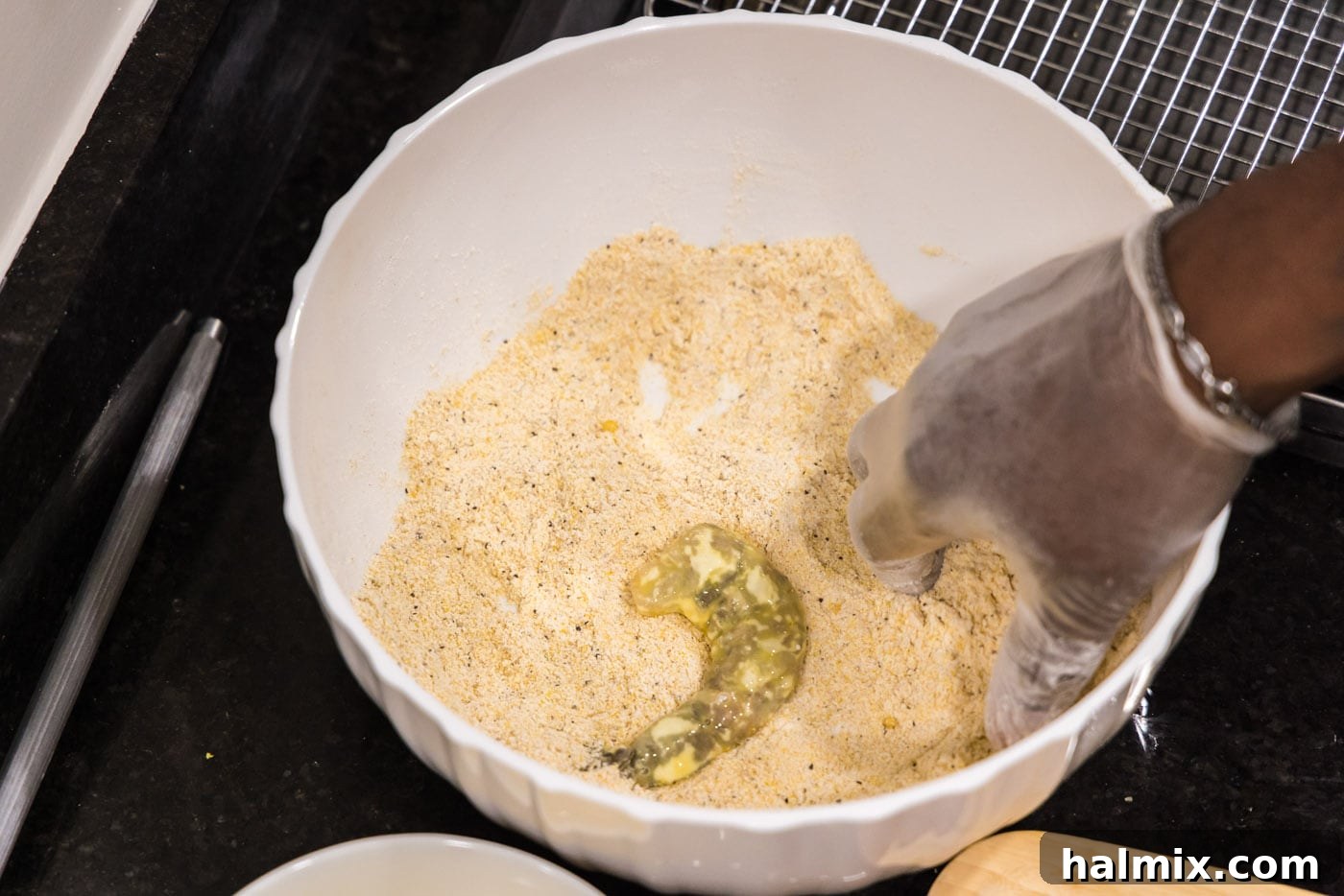 Golden Crispy Shrimp 10 dredged shrimp in a bowl with cornmeal mixture