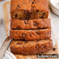 Ultimate Chocolate Chip Banana Bread 17 Close up of a loaf of Chocolate Chip Banana Bread cut in slices