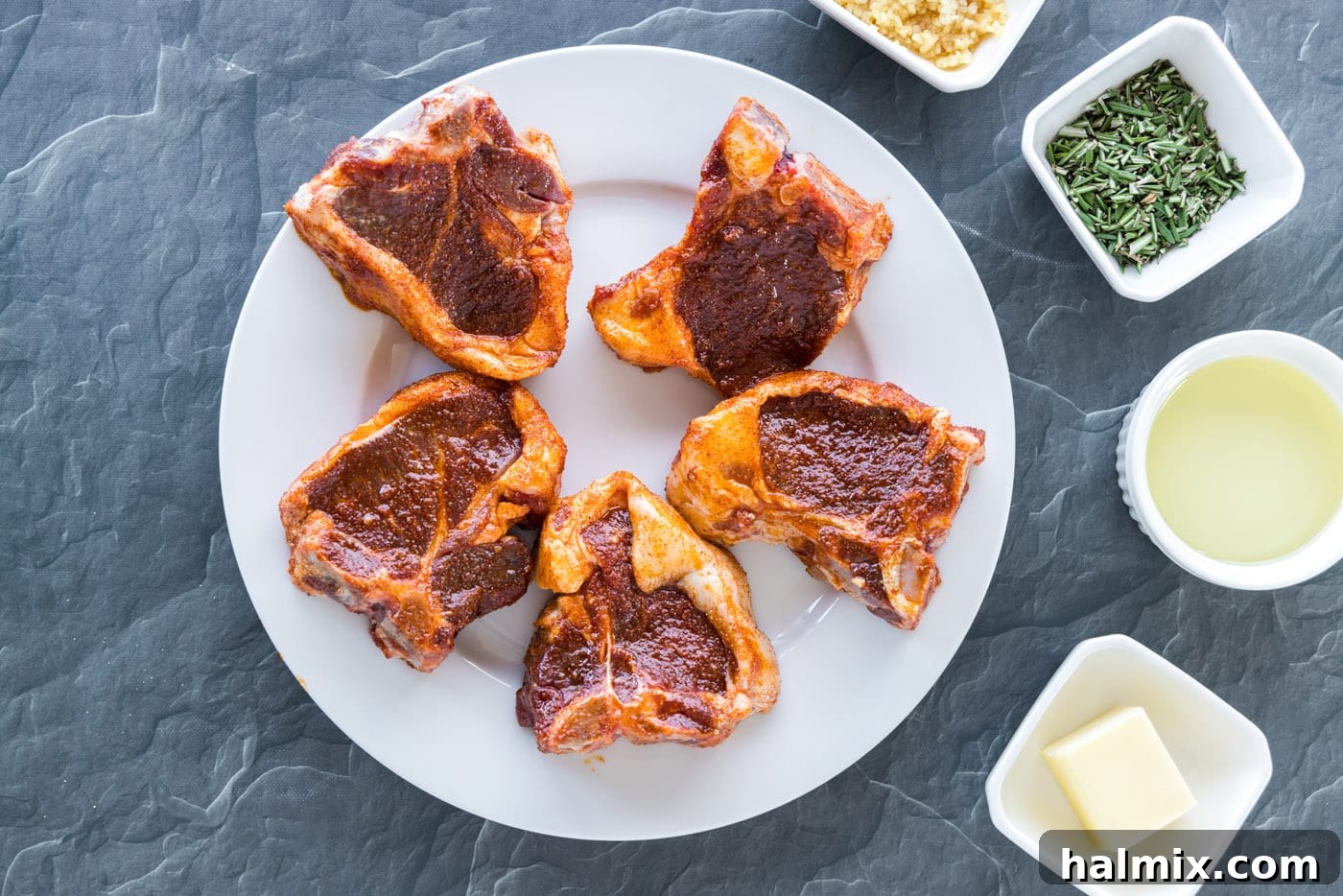 Lamb loin chops covered with a wet rub of spices and olive oil