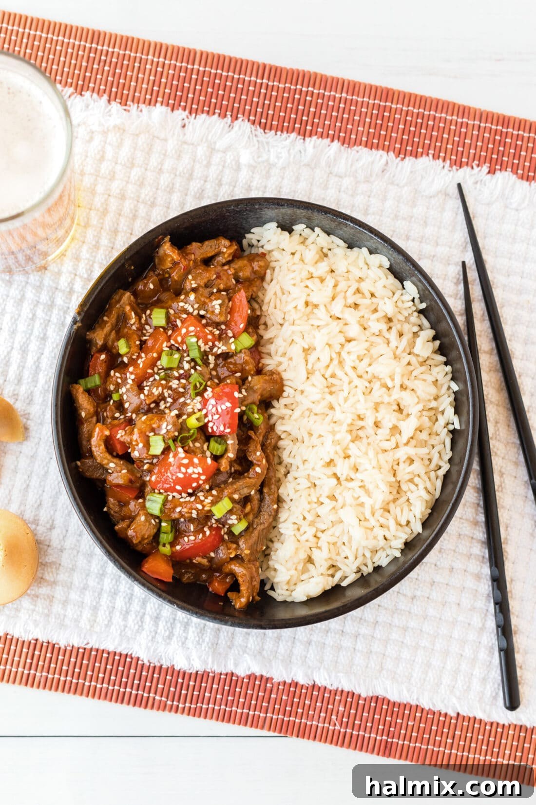 Overhead photo of Beijing Beef in a bowl with rice