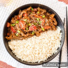 Beijing Beef served with rice in a bowl