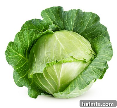Low Carb Vegetables: Your Essential Guide to What to Eat and What to Skip 11 A fresh head of green cabbage isolated on a white background.