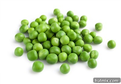 Low Carb Vegetables: Your Essential Guide to What to Eat and What to Skip 16 A pile of fresh, young green peas in their pods.